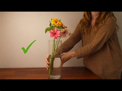 how to properly put flowers in a vase what is the best way to arrange them for a stunning display?